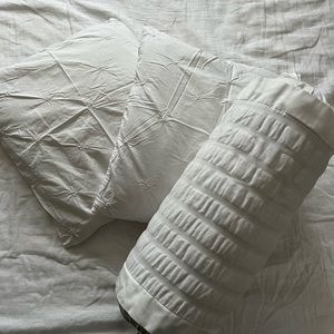 Set of three pillows (two square, one long)